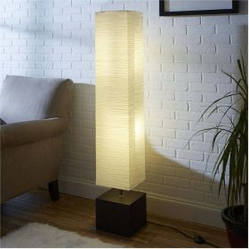 Rice paper floor lamp with dark wood base; bulb and paper shade